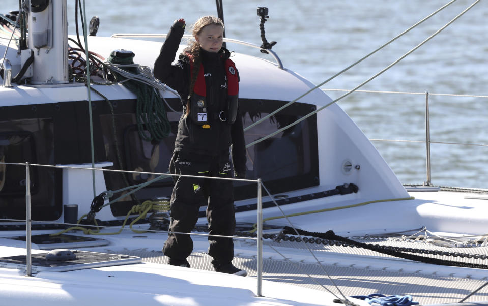 FILE - In this Tuesday, Dec 3, 2019 file photo Climate activist Greta Thunberg arrives in Lisbon aboard the sailboat 'La Vagabonde'. In a wide-ranging monologue on Swedish public radio, teenage climate activist Greta Thunberg recounts how world leaders queued up to have their picture taken with her even as they shied away from acknowledging the grim scientific fact that time is running out to curb global warming. (AP Photo/Pedro Rocha, file)