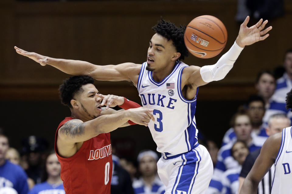 Duke guard Tre Jones (3) guards Louisville guard Lamarr Kimble (0) during the second half of an NCAA college basketball game in Durham, N.C., Saturday, Jan. 18, 2020. Louisville won 79-73. (AP Photo/Gerry Broome)