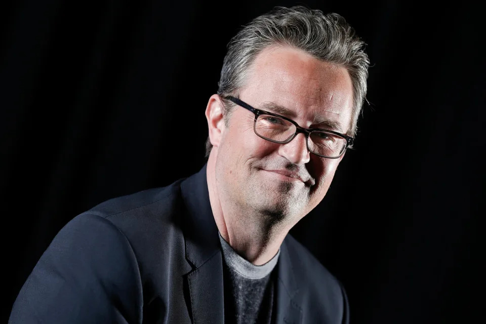 Matthew Perry smiles as he poses for a photograph. (Brian Ach / Invision/AP file)