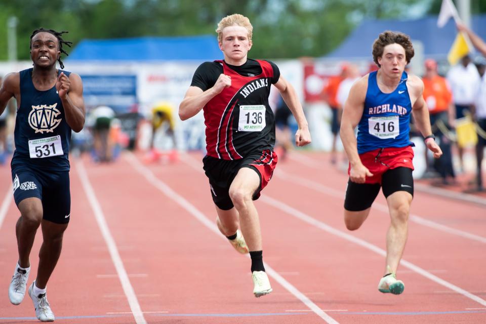 Conemaugh Township Area's Ethan Black (center) sprints to a first-place finish (10.78) in the 2A boys' 100-meter dash at the PIAA Track and Field Championships at Shippensburg University on Saturday, May 28, 2022. 
