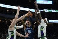 Memphis Grizzlies' Ja Morant loses the ball during the second half of an NBA basketball game against the Milwaukee Bucks Wednesday, Jan. 19, 2022, in Milwaukee. (AP Photo/Morry Gash)