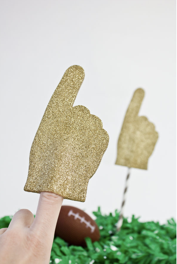 <p>If you're looking for an easy DIY project, try making your own glitter foam fingers, so guests can cheer on their respective teams in style. </p><p><a href="https://studiodiy.com/diy-glitter-foam-fingers/" rel="nofollow noopener" target="_blank" data-ylk="slk:Get the tutorial at Studio DIY »;elm:context_link;itc:0;sec:content-canvas" class="link "><em>Get the tutorial at Studio DIY »</em></a></p>