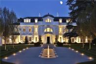 <p>With a castle-like facade, this charming mansion is nestled in the internationally renowned St George's Hill private residential estate. Inside, it has a cinema room, beautiful semi-circular orangery, grand swimming pool, a sauna, spa, and a gym, too. </p><p><a href="https://www.rightmove.co.uk/properties/89053205#/" rel="nofollow noopener" target="_blank" data-ylk="slk:This property is currently on the market for £22,490,000 at Knight Frank via Rightmove;elm:context_link;itc:0;sec:content-canvas" class="link ">This property is currently on the market for £22,490,000 at Knight Frank via Rightmove</a>. </p>