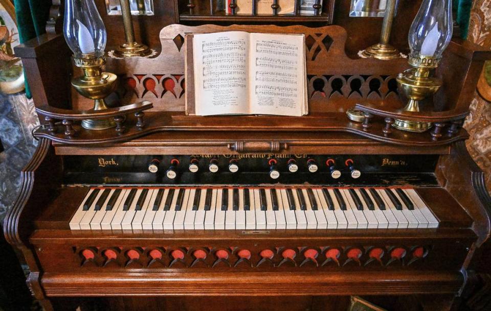 A pump organ sits in one of the rooms of the Meux Home on Friday, April 26, 2024. Pump organs used air to generate sound.