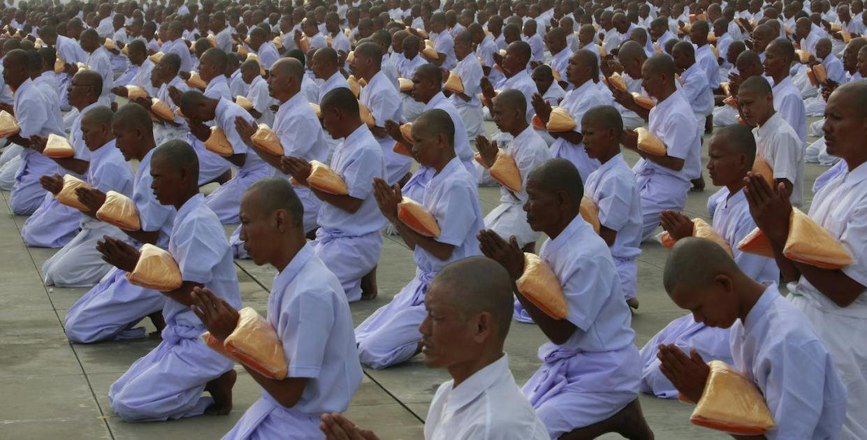 Novice Buddhist monks during a mass ordination at Dhamagaya Temple in central Thailand in 2010. <a href="https://newsroom.ap.org/detail/ThailandBuddhism/64207cadb1594c6484a5bc99bcdb3cf5/photo?Query=ordination%20buddhist%20monks&mediaType=photo&sortBy=&dateRange=Anytime&totalCount=68&currentItemNo=48" rel="nofollow noopener" target="_blank" data-ylk="slk:AP Photo/Apichart Weerawong;elm:context_link;itc:0;sec:content-canvas" class="link ">AP Photo/Apichart Weerawong</a>