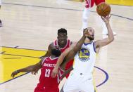 May 20, 2018; Oakland, CA, USA; Golden State Warriors guard Stephen Curry (30) extends for the ball against Houston Rockets guard James Harden (13) during the third quarter of game three of the Western conference finals of the 2018 NBA Playoffs at Oracle Arena. Mandatory Credit: Kelley L Cox-USA TODAY Sports