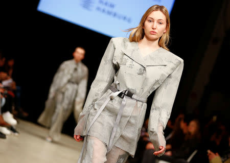 A model presents a creation by students of fashion colleges during the Berlin Fashion Week Autumn/Winter 2019/20 in Berlin, Germany, January 14, 2019. REUTERS/Fabrizio Bensch