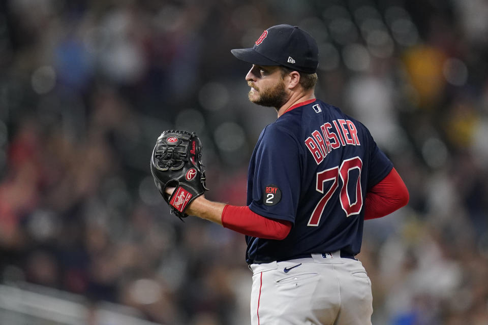Boston Red Sox relief pitcher Ryan Brasier reacts after giving up a grand slam to Minnesota Twins' Nick Gordon during the fifth inning of a baseball game Tuesday, Aug. 30, 2022, in Minneapolis. (AP Photo/Abbie Parr)