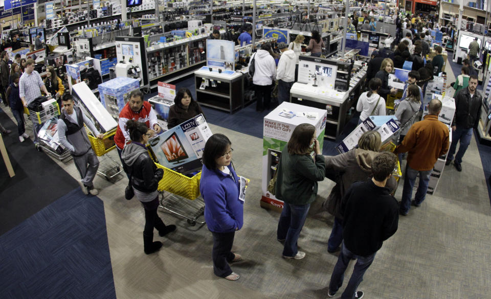 FILE-In this Friday, Nov. 25, 2011, file photo, a checkout line winds through a Best Buy store as shoppers take advantage of a midnight Black Friday sale on Friday, Nov. 25, 2011, in Brentwood, Tenn. The National Retail Federation, the nation's largest retail trade group, said Tuesday, Oct. 2, 2012, that it expects sales during the winter holiday shopping period in November and December to rise 4.1 percent this year. (AP Photo/Mark Humphrey, File)