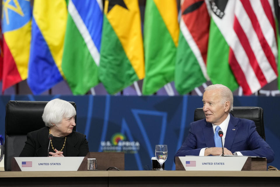 FILE - Treasury Secretary Janet Yellen, left, listens as President Joe Biden speaks during the closing session at the U.S.-Africa Leaders Summit on promoting food security and food systems resilience in Washington, Dec. 15, 2022. (AP Photo/Susan Walsh, File)