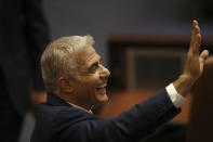 Israeli politician Yair Lapid of the Yesh Atid party sends greetings during a Knesset session in Jerusalem Sunday, June 13, 2021. Bennett is expected later Sunday to be sworn in as the country's new prime minister, ending Prime Minister Benjamin Netanyahu's 12-year rule. (AP Photo/Ariel Schali22