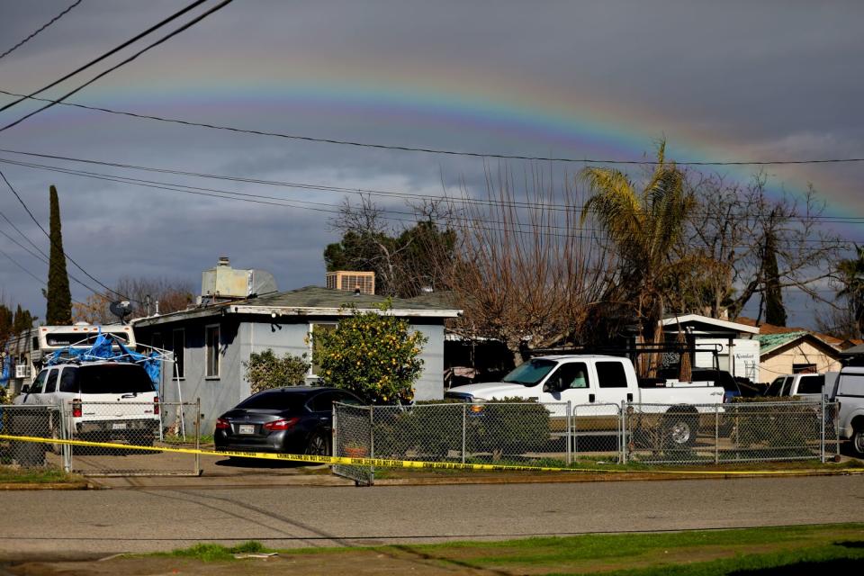 Crime scene tape outside a residence