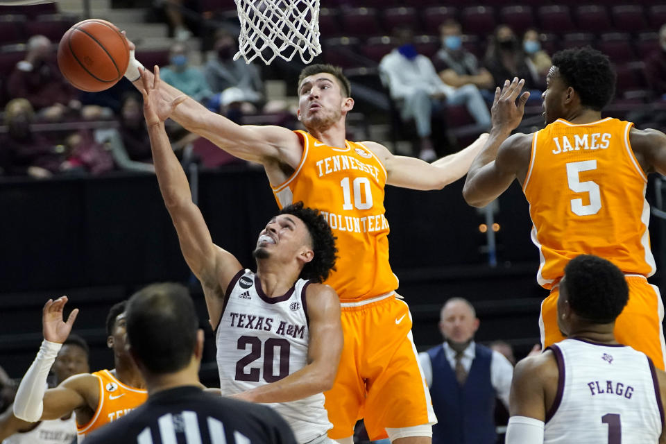 Tennessee forward John Fulkerson (10) blocks a shot by Texas A&M guard Andre Gordon (20) during the second half of an NCAA college basketball game Saturday, Jan. 9, 2021, in College Station, Texas. (AP Photo/Sam Craft)