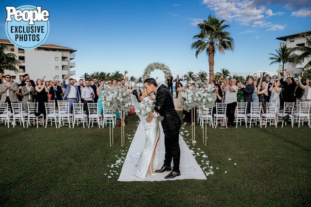 <p>Eduardo Mejia/Adventure Photos</p> Paul Karmiryan and Stella Mayilyan kiss after saying "I do."