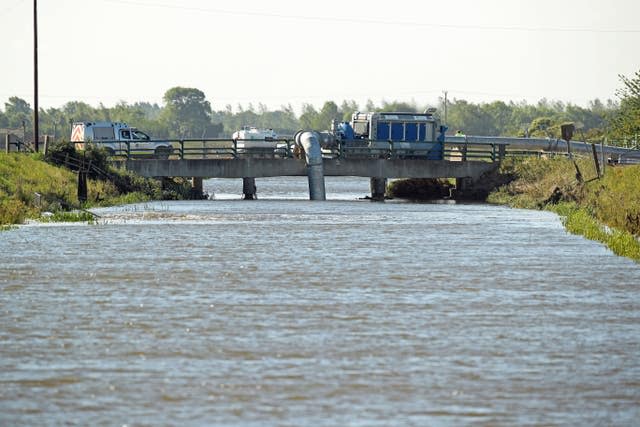 High-volume pumps are being used to pump flood water back into a river in Lincolnshire