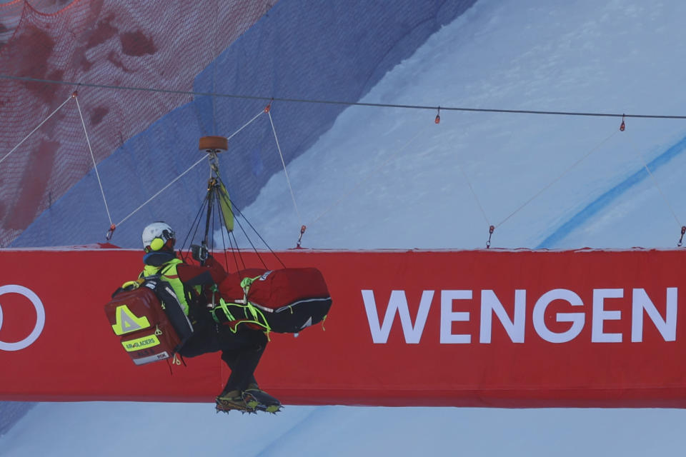 Norway's Aleksander Aamodt Kilde is lifted to the helicopter after falling during an alpine ski, men's World Cup downhill race, in Wengen, Switzerland, Saturday, Jan. 13, 2024. (AP Photo/Alessandro Trovati)