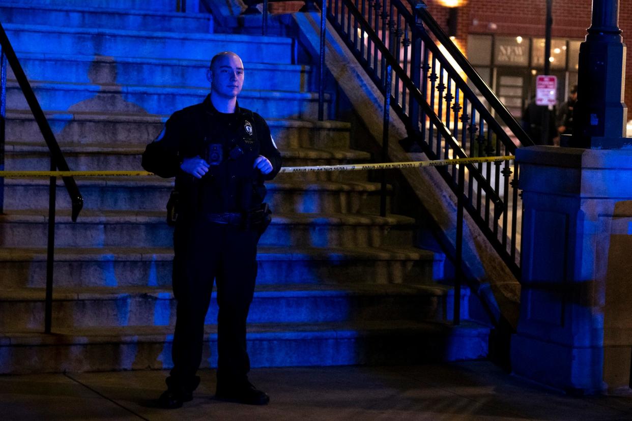 Police work a crime scene at Newport on the Levee in Newport, Ky., on Saturday, March 16, 2024.