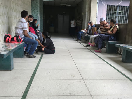 People wait in a hallway of the Jose Gregorio Hernandez hospital in the slum of Catia in Caracas, Venezuela November 20, 2018. Picture taken November 20, 2018. REUTERS/Marco Bello