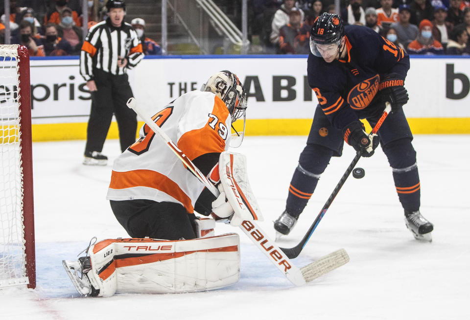 Philadelphia Flyers goalie Carter Hart (79) makes the save on Edmonton Oilers' Zach Hyman (18) during the second period of an NHL hockey game, Wednesday, Oct. 27, 2021 in Edmonton, Alberta. (Jason Franson/The Canadian Press via AP)