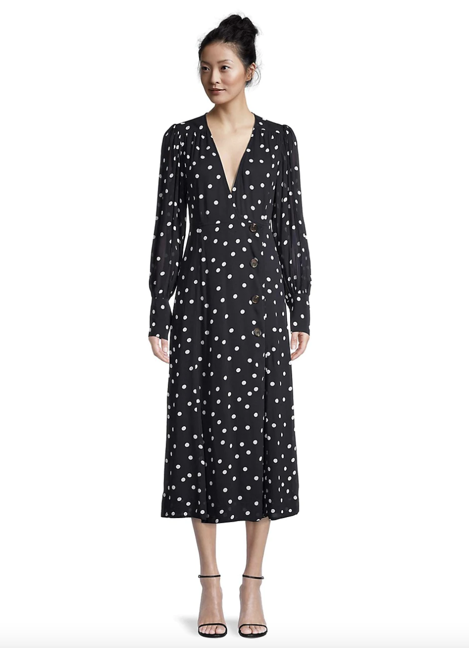 model in long sleeve black Ganni Plunging V-Neck Polka Dot Georgette Dress (Photo via The Bay)