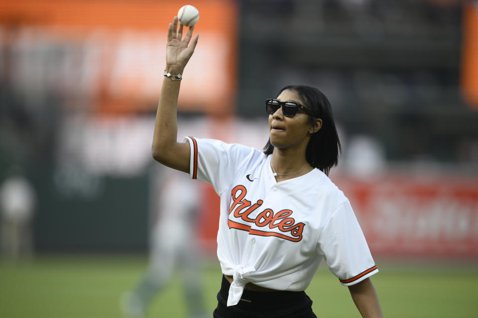 LSU women's basketball star Angel Reese throws out a ceremonial first pitch before a baseball game between the Baltimore Orioles and the Los Angeles Dodgers, Tuesday, July 18, 2023, in Baltimore. (AP Photo/Nick Wass)