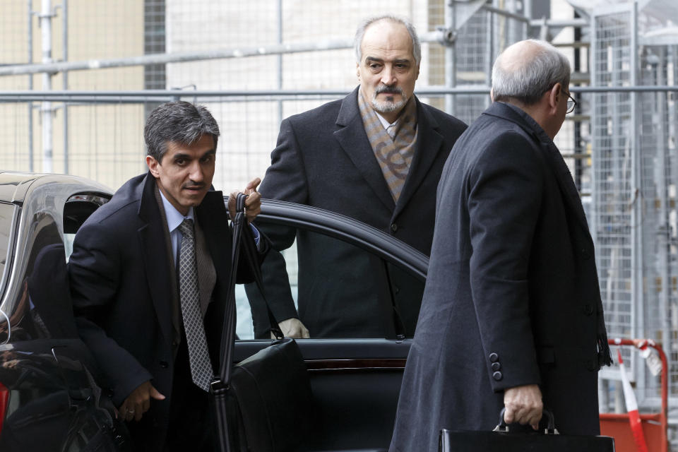 Syrian chief negotiator Bashar Jaafari, Ambassador of the Permanent Representative Mission of Syria to the UN in New York, center, arrives for a meeting during the second round of negotiations between the Syrian government and the opposition at the European headquarters of the United Nations, in Geneva, Switzerland, Saturday, Feb. 15, 2014. Others are not identified. (AP Photo/Keystone, Salvatore Di Nolfi)