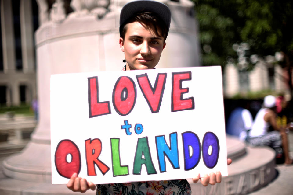 <p>Ciaran Lithgow holds a sign of condolence for victims of the attack on a gay nightclub in Orlando, Fla., early this morning in Washington, D.C., June 12, 2016. (Reuters/James Lawler Duggan) </p>