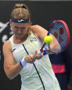 Marie Bouzkova of the Czech Republic plays a backhand return to Bianca Andreescu of Canada during their first round match at the Australian Open tennis championship in Melbourne, Australia, Monday, Jan. 16, 2023. (AP Photo/Ng Han Guan)