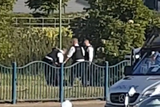 Arrest: Three police officers detaining the suspect (Premises187)