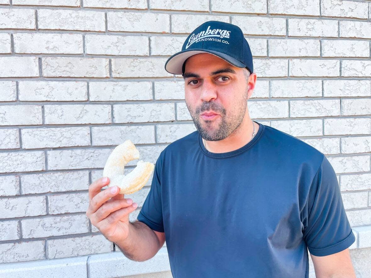 Boaz Rachamin is the owner of Eisenbergs Sandwiches, one of over more than 200 restaurants participating in this year's Summerlicious program in Toronto. He says the food is inspired by his family from Montreal, with roots in Jerusalem. (Submitted by Boaz Rachamim - image credit)