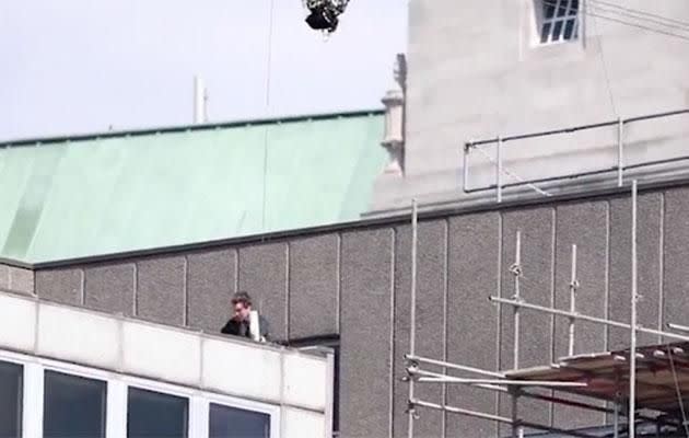 The actor was seen hanging onto the side of the rooftop. Source: Supplied