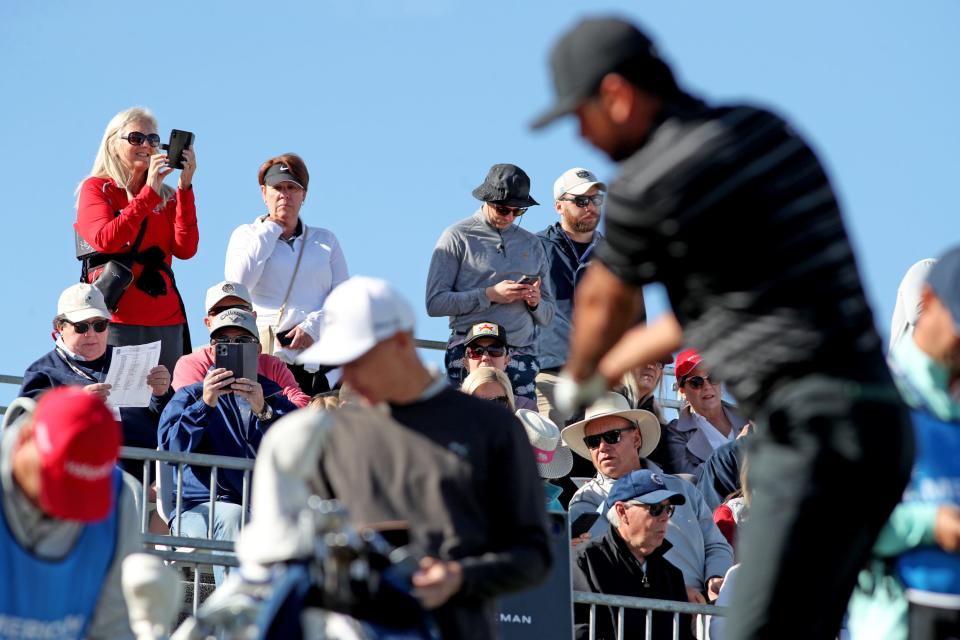 Golf fans watch as Jason Day prepares to tee off on the first tee during the final round of The American Express at PGA West in La Quinta, Calif., on Sunday, Jan. 22, 2023. 