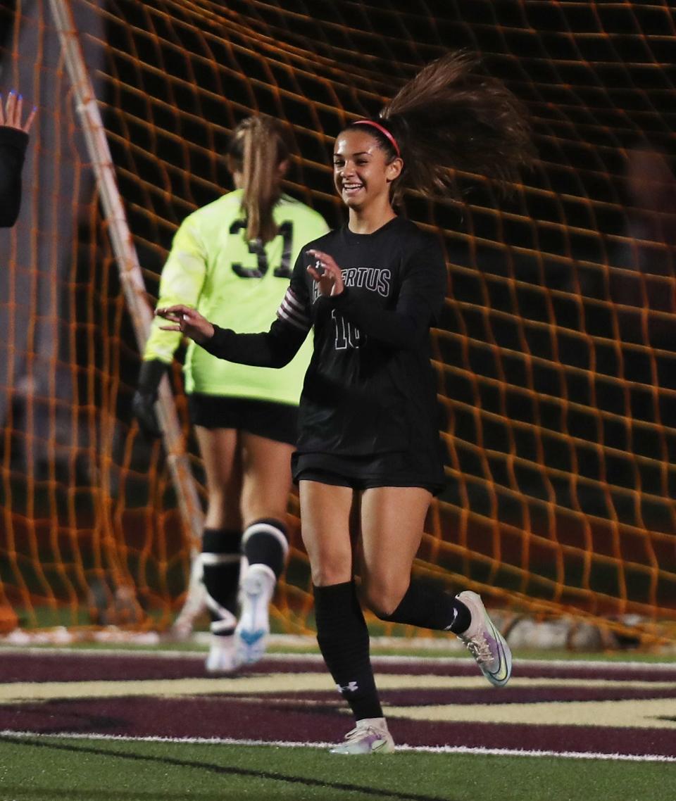 Albertus Magnus' Isabel DiPrima (10) celebrates a first half goal against Goshen during the girls soccer Class B state regional semifinals at Arlington High School in Lagrangeville Nov. 1, 2022. 