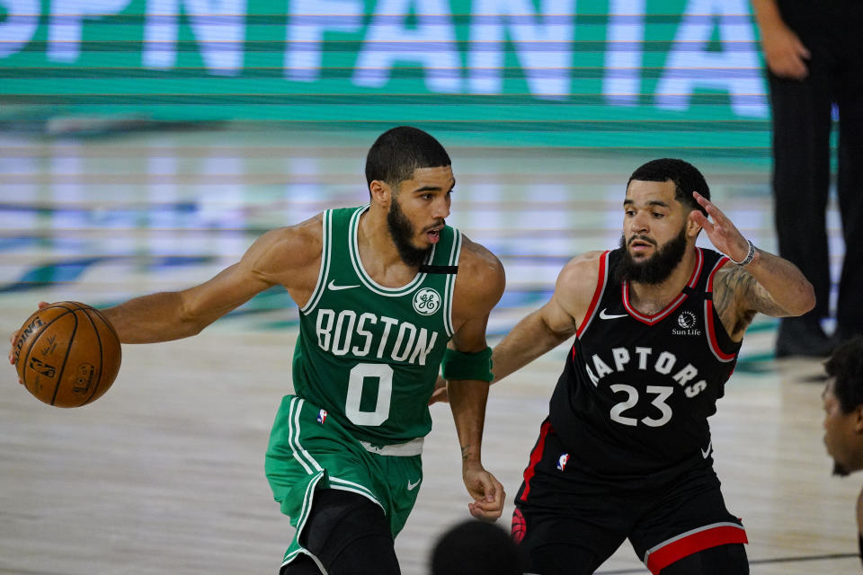 Boston Celtics forward Jayson Tatum (0) drives on Toronto Raptors guard Fred VanVleet (23). (AP Photo/Mark J. Terrill)