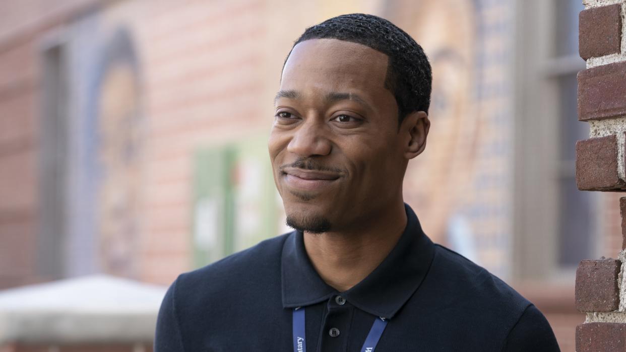  Tyler James Williams as Gregory smiling in Abbott Elementary season 3. 