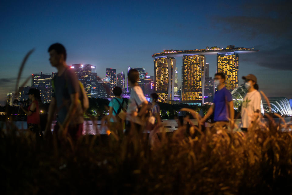 People cycle and walk after sunset in the Gardens by the Bay park in Singapore on Saturday, 6 November, 2021. (Photo by Joseph Nair/NurPhoto via Getty Images)