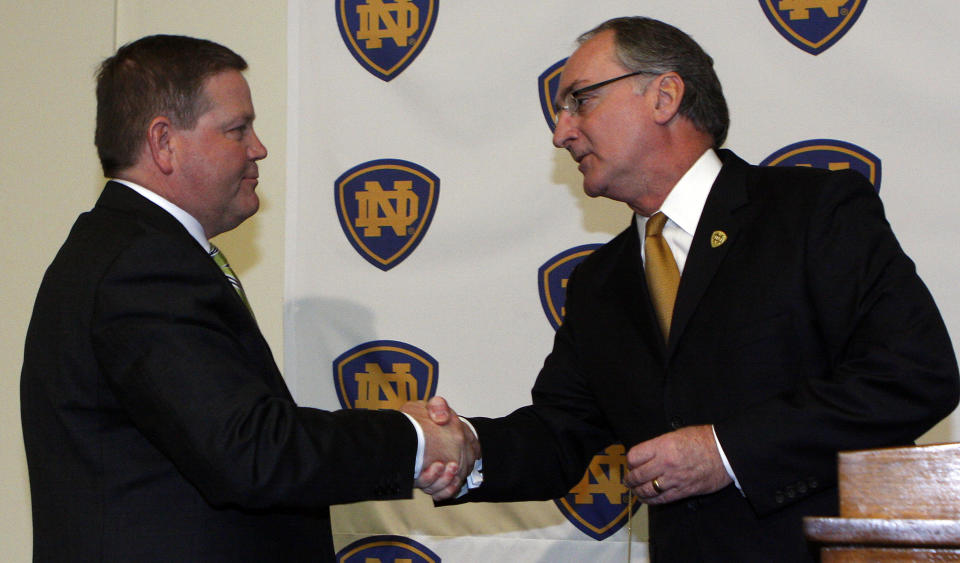 Since Jack Swarbrick, right, hired Brian Kelly in 2009, Notre Dame has gone 60-31, including a loss in the 2012 national championship game. (Getty)