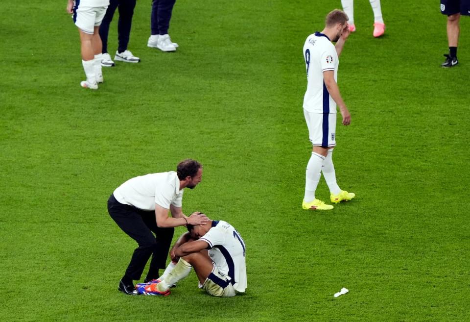 Southgate commiserates with Jude Bellingham following England’s defeat in the final (PA Wire)