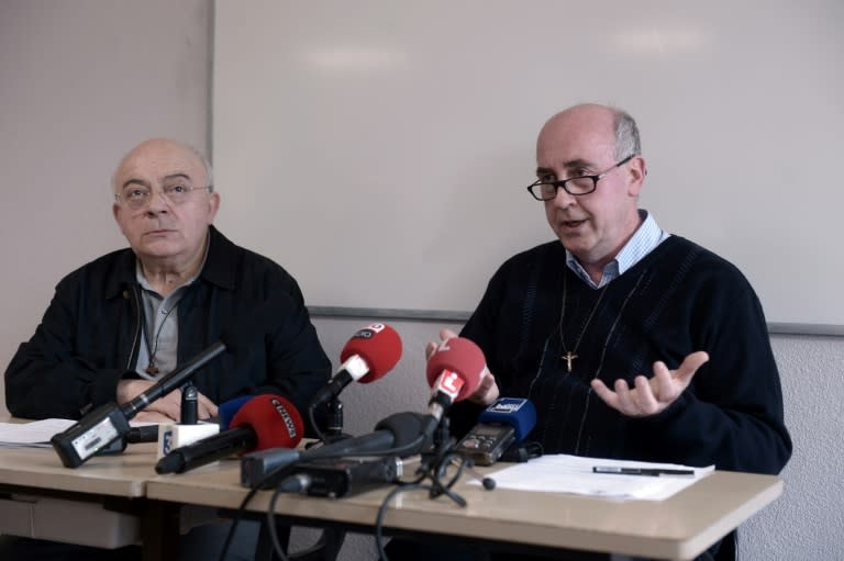 Fathers Bernard Hayet (L) and Denis Cazaux deliver a press conference at the diocese of Dax on April 6, 2017, after the resignation of a French bishop over "inappropriate behaviour" towards youths