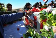 Mourners escort the flag-draped coffin of Abu Mahdi al-Muhandis, deputy commander of Iran-backed militias during his funeral procession in Basra, Iraq, Tuesday, Jan. 7, 2020. Thousands of people gathered in Basra on Tuesday to bid farewell to Abu Mahdi al-Muhandis, a senior Iraqi militia commander who was killed in a US airstrike on Friday. (AP Photo)