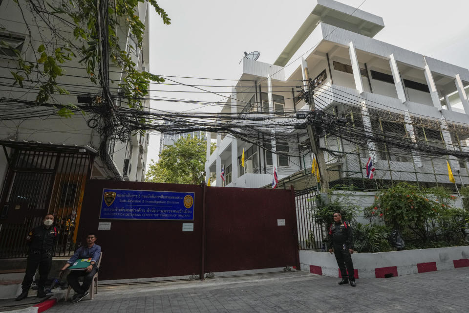 Security members stand guard outside the Immigration Detention Center in Bangkok, Thailand, Tuesday, Jan. 30, 2024. Members of Bi-2, a visiting dissident rock band that has been critical of Moscow’s war in Ukraine, were arrested Thursday in Thailand's southern resort island of Phuket for playing without proper working papers and sent to the immigration jail in Bangkok, according to Sunai Phasuk of Human Rights Watch and reports in the Israeli press. The band members might face deportation to Russia, according to the human rights advocates and fans on Monday. (AP Photo/Sakchai Lalit)