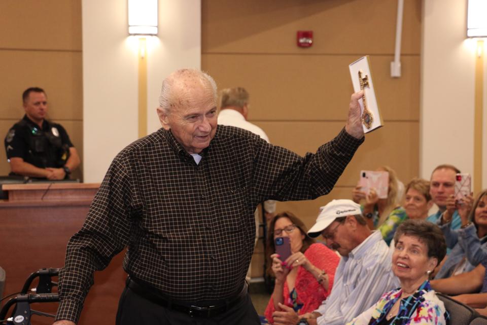 Gene Matthews, who served on both the Sarasota County Commission and Sarasota County School Board, shows off the key to the city he received Tuesday morning from the North Port City Commission. The commission also designated April 11, 2023 as Gene Matthews Day, while the Boys & Girls Clubs of Sarasota and DeSoto Counties later unveiled plans for a new $4.5 million, 14,000-square-foot building to replace two structures damaged by Hurricane Ian at the Gene Matthews Boys & Girls Club.