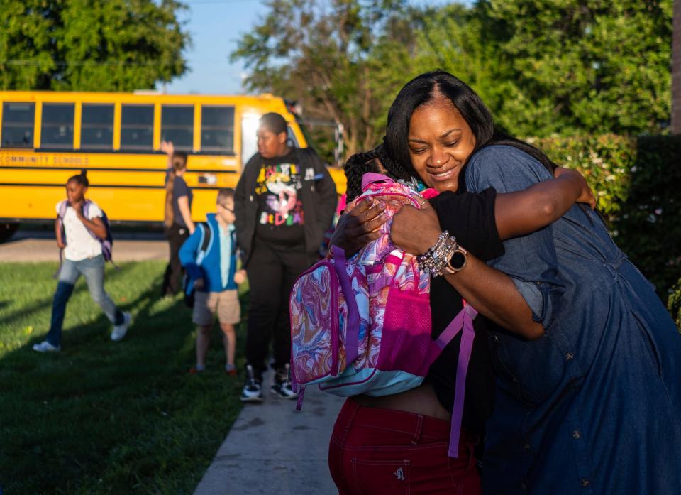 Pleasantview Elementary principal Falicia Moreland-Trice gets a hug from Nyla Overall while lining up with other students during the first day of school at Pleasantview Elementary School in Eastpointe on Monday, Aug. 28, 2023.