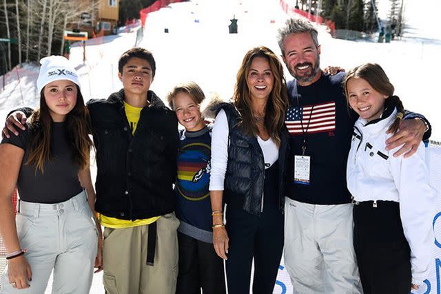 <p>Brooke Burke/Instagram</p> Brooke Burke and fiancé Scott Rigsby pose with four of their six respective children