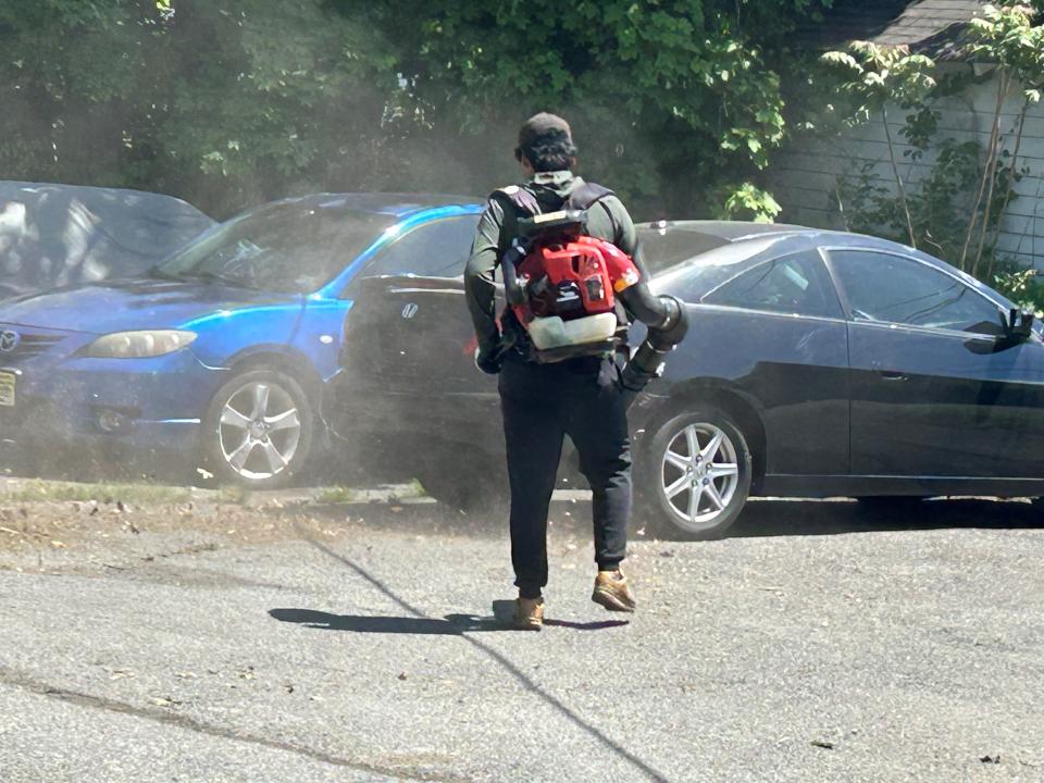 A landscaper uses a gas-powered leaf blower in Morristown in violation of the town's new leaf-blower ordinance, which prohibits the use of gas-powered blowers from January to September. May 7, 2024.