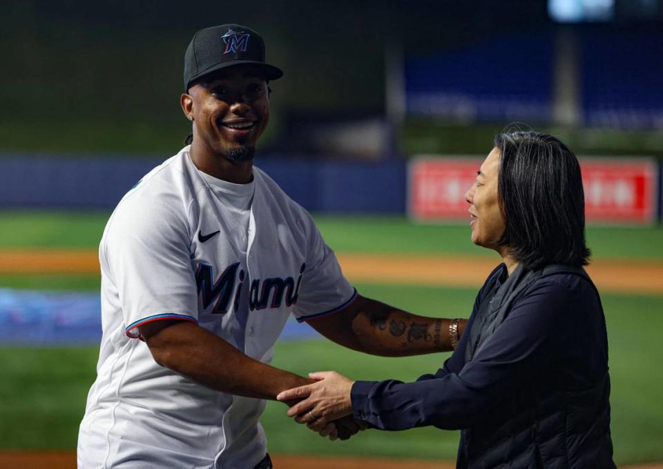 Jean Segura, new Miami Marlins infielder, left, shakes hands with Kim Ng, Marlins General Manager, after welcoming him to the team on Wednesday, Jan. 11, 2023, at loanDepot Park.