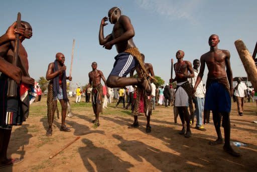 Southern Sudanese men dance in Juba to celebrate their country's first independence anniversary. Dancing and singing, South Sudanese on Monday put aside dire warnings over the stability and economic viability of their fledgling nation, the world's newest, to celebrate its first year of independence