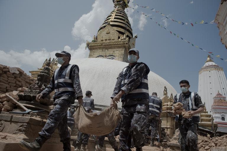 Nepalese soldiers clear rubble at the damaged Swayambunath Temple in Kathmandu, following a 7.8-magnitude earthquake which struck the Himalayan nation on April 25