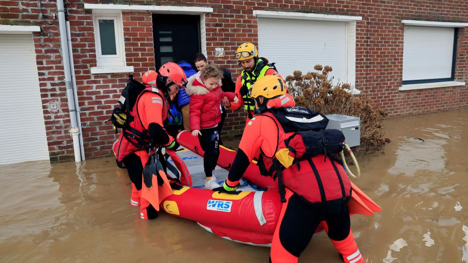 Rescuers evacuate local residents by boat as the Aa River overflows in Arques near Saint-Omer, after heavy rain caused flooding in northern France on January 3. - Pascal Rossignol/Reuters