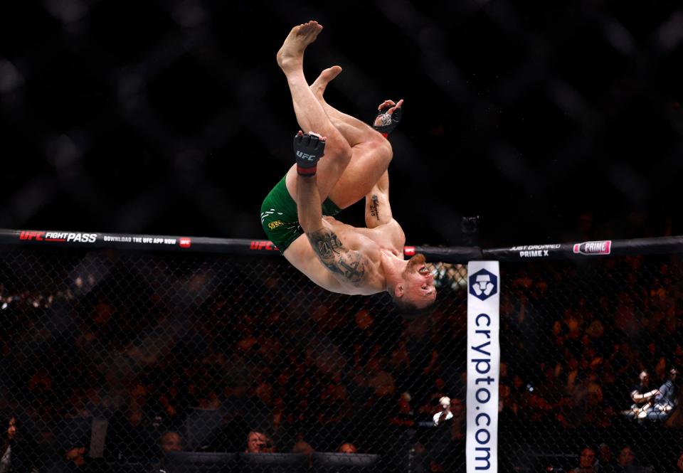 Mixed Martial Arts - UFC 304 - Manchester - Co-op Live, Manchester, Great Britain - July 28, 2024. Modestas Bukauskas celebrates performing a flip after winning his fight against Marcin Prachnio via submission.  REUTERS/John Sibley